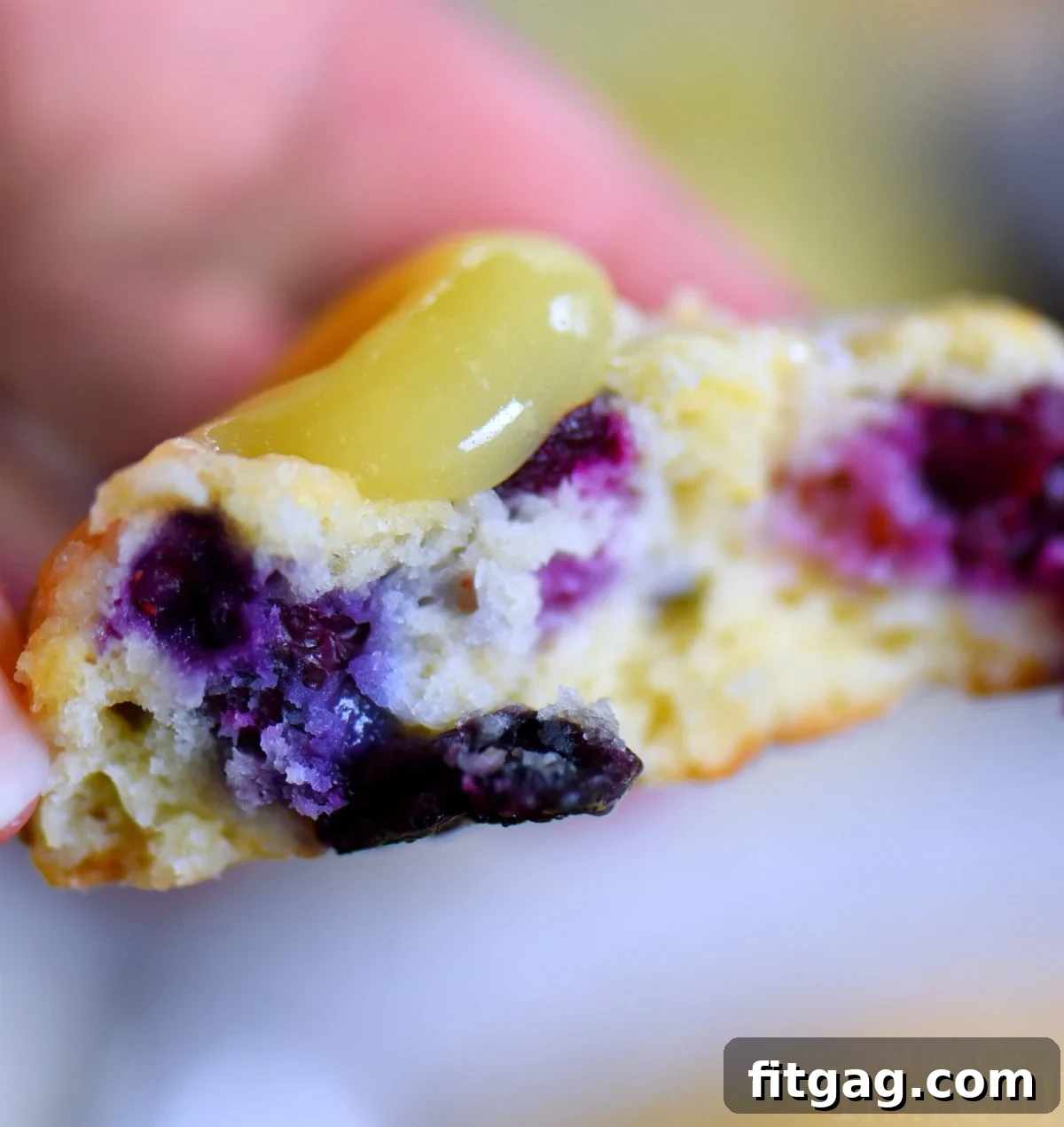 Sunshine Lemon Blueberry Scones 4 Close-up of a perfectly golden-brown lemon blueberry scone with a dusting of sanding sugar