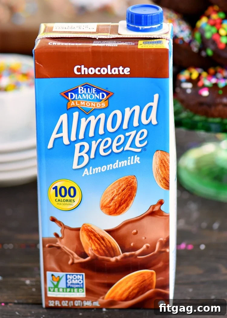 Ingredients for making chocolate cake mix donuts and glaze, including Almond Breeze almondmilk.