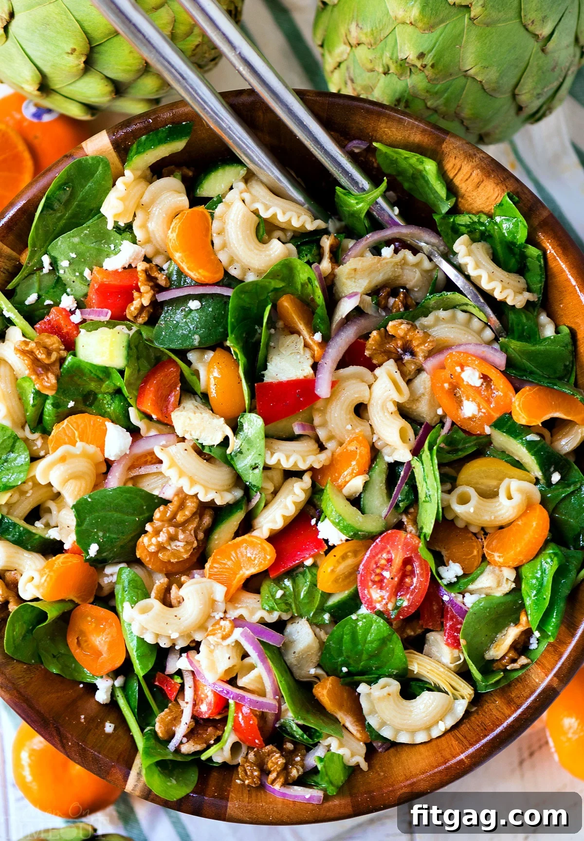 Delicious Perfect Pasta Salad with spinach, artichokes, and mandarins – a vibrant and healthy summer side dish for BBQs and parties.