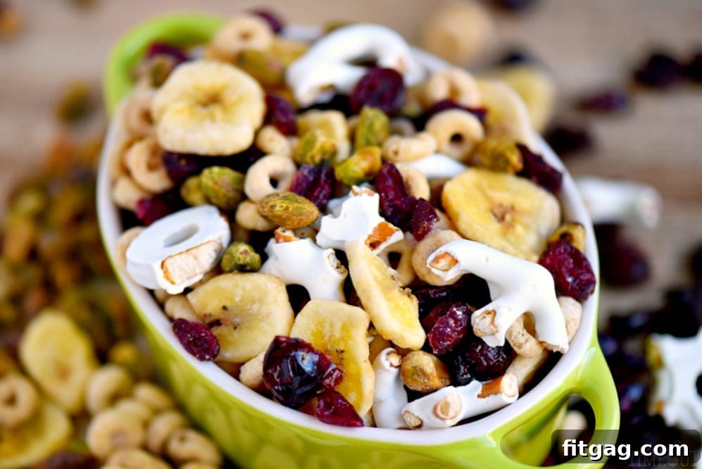 Serving of customizable Breakfast Trail Mix on a white plate, highlighting the delicious mix of ingredients.