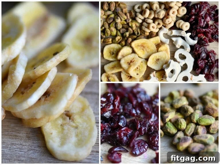 Ingredients for Breakfast Trail Mix laid out: dried cranberries, pistachios, dried banana chips, Honey Nut Cheerios, and yogurt-covered pretzels.