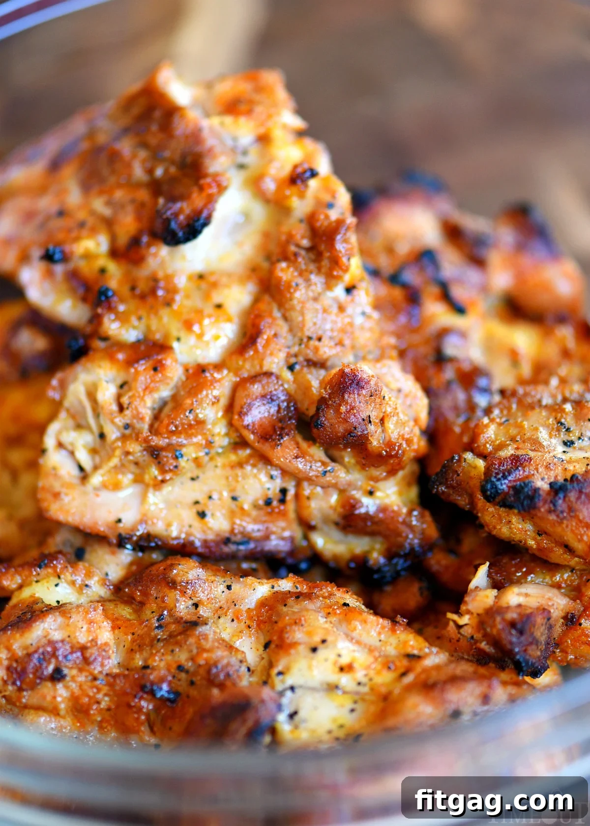 A small bowl containing a homemade grilled chicken rub, perfectly blended and ready to season the chicken thighs for the BBQ pulled chicken recipe.