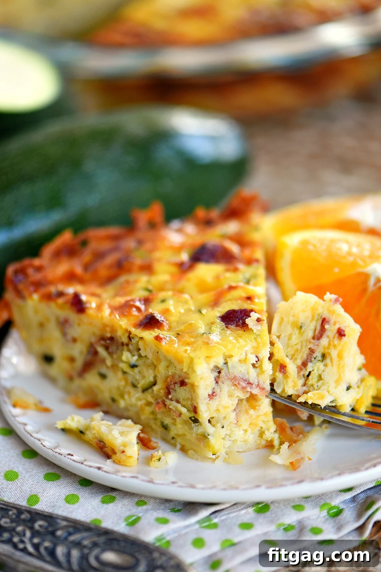 Slice of Zucchini Quiche with Bacon and Hash Brown Crust