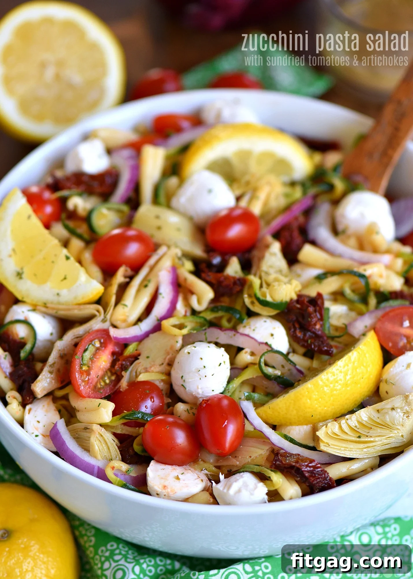 Delicious Zucchini Pasta Salad with Sun Dried Tomatoes and Mozzarella, perfect for summer gatherings.
