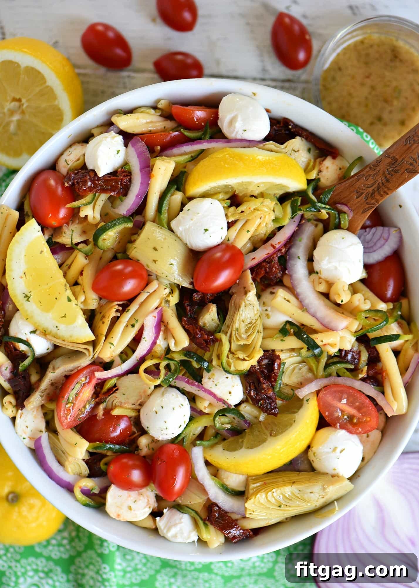 A close-up of Zucchini Pasta Salad with Sun Dried Tomatoes and Mozzarella, ready to be served.