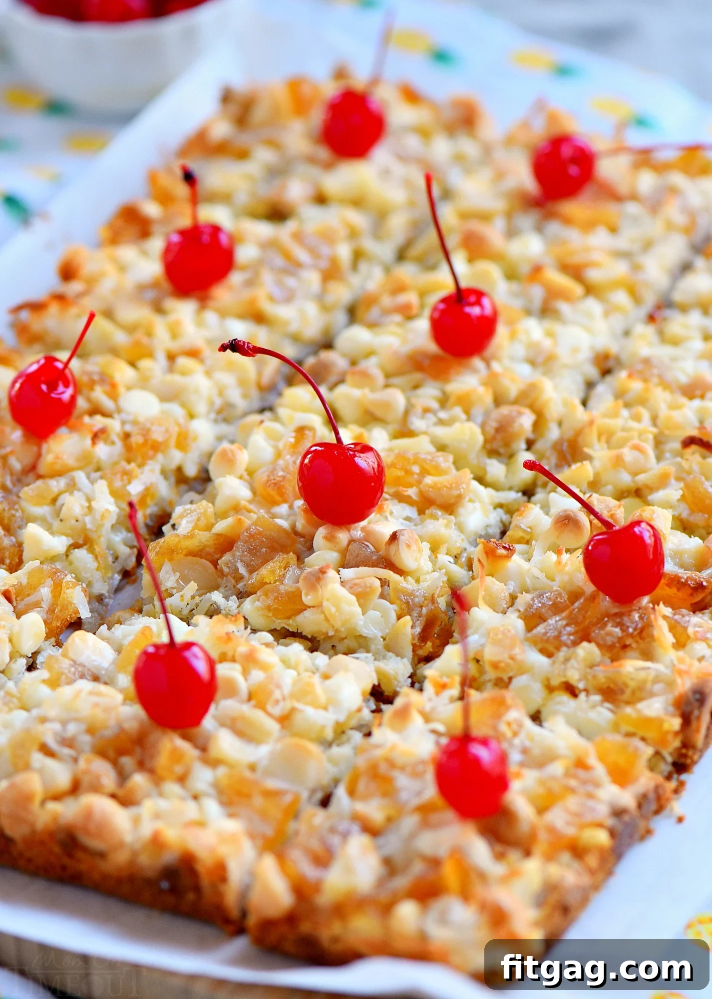 Cut Piña Colada Magic Bars showing layers