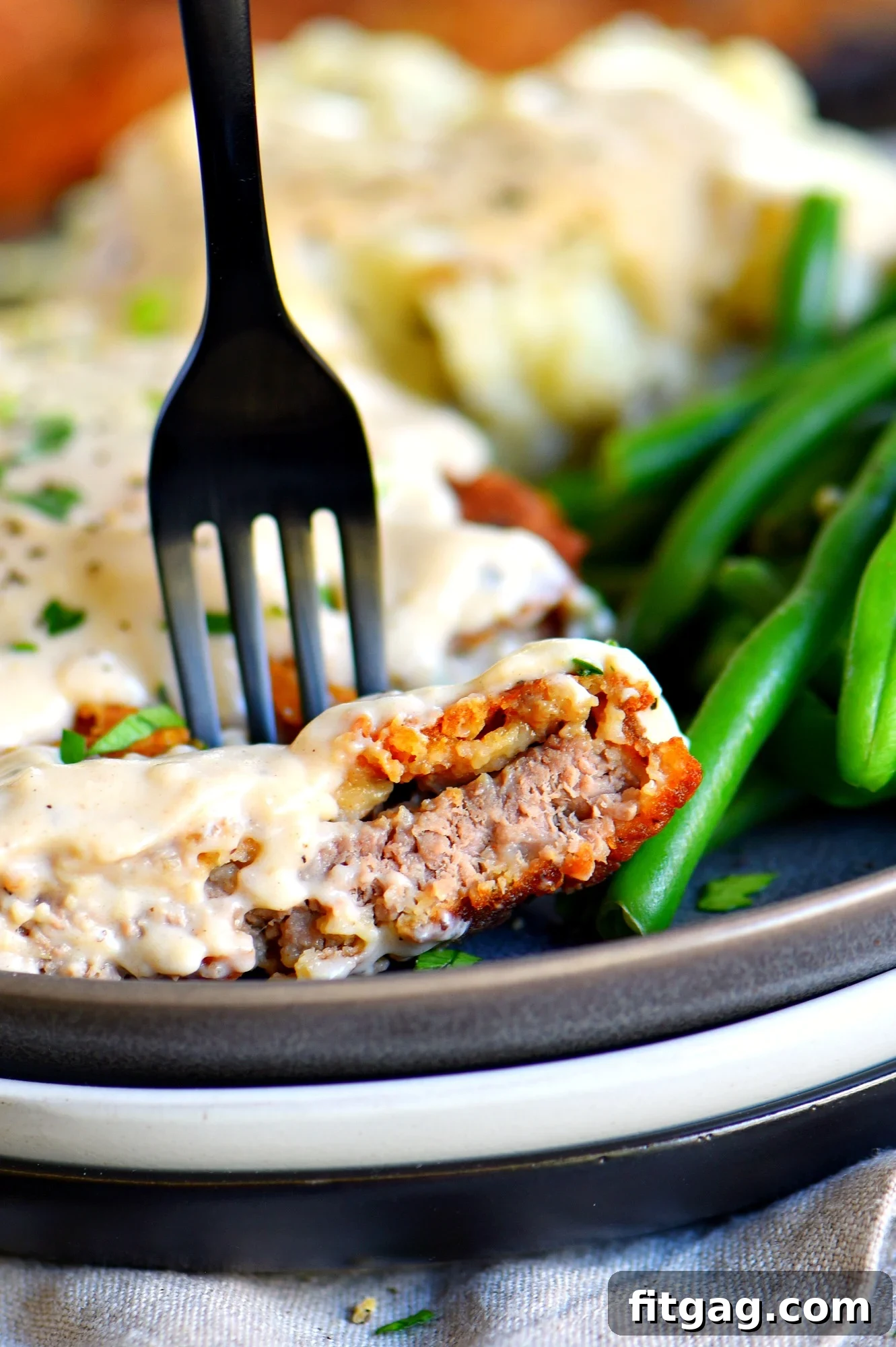 Close-up of a bite of the best chicken fried steak
