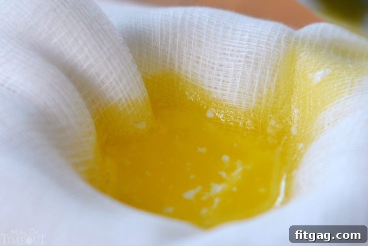 Multiple layers of cheesecloth placed over a glass bowl, ready for straining clarified butter.
