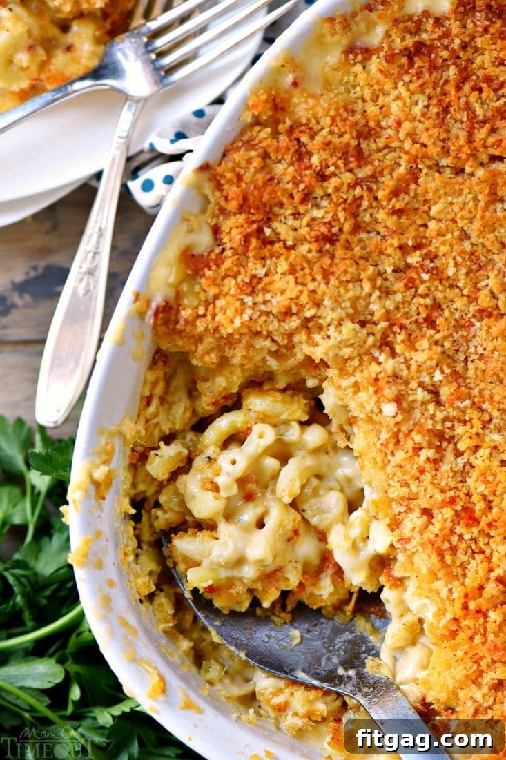 Three different cheeses ready to be mixed into the mac and cheese sauce in a baking dish.