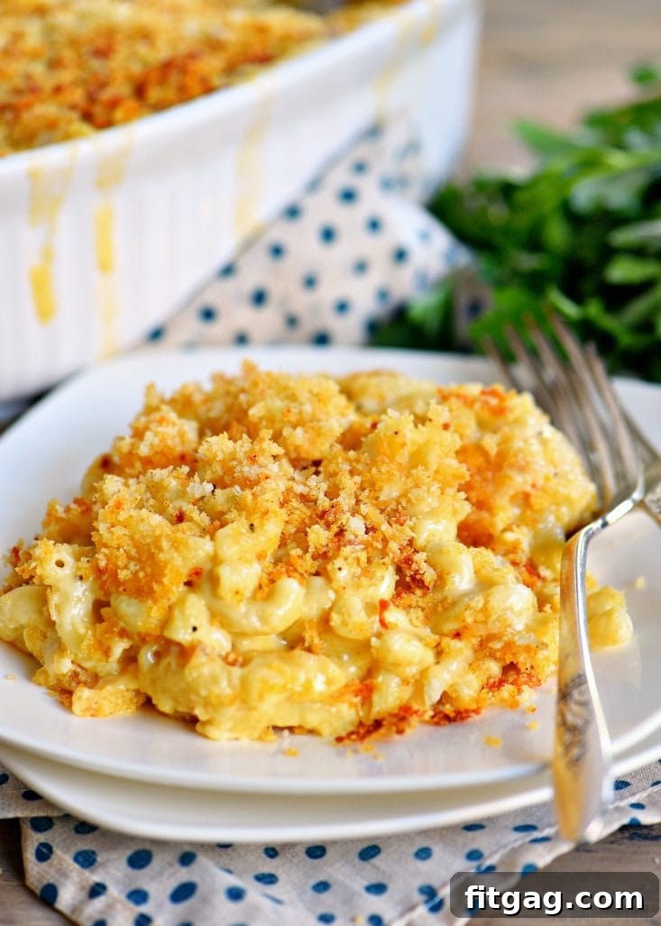 A dish of homemade mac and cheese with a golden-brown Panko crust, ready to be served.