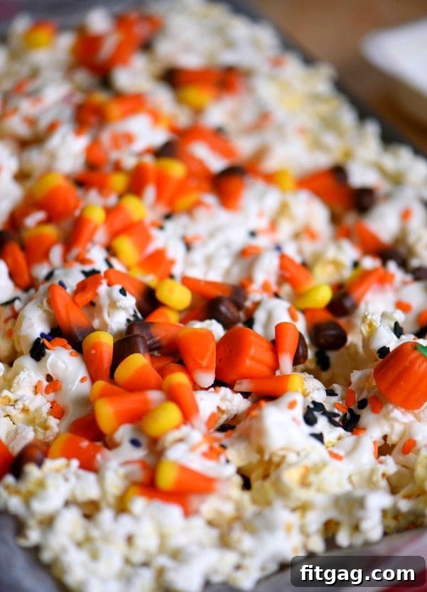 Close-up of Halloween-themed Candy Corn Popcorn Mix with sprinkles