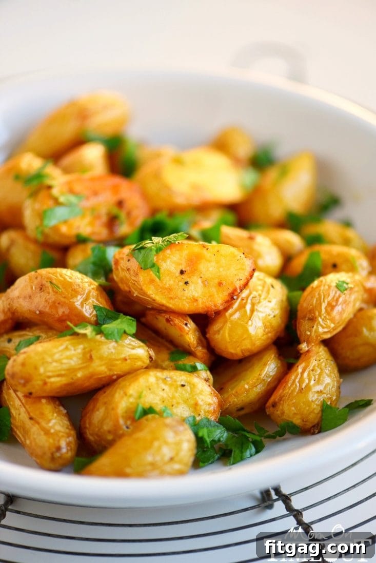 Golden and crispy oven roasted potatoes, seasoned with garlic. Crispy Oven Roasted Potatoes with Garlic