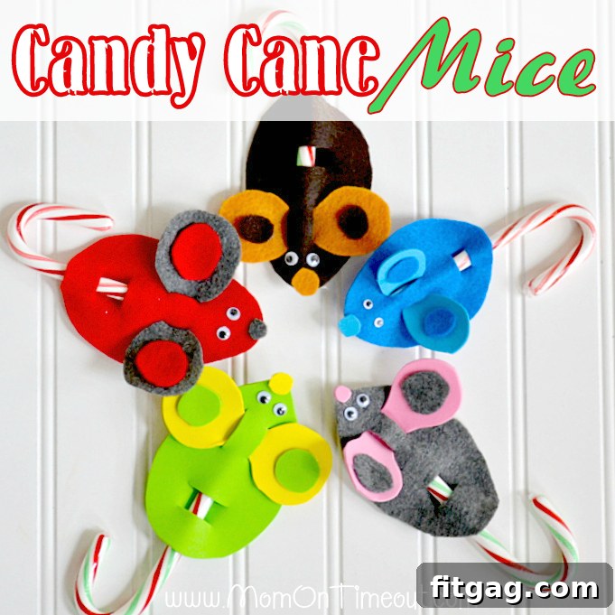 An array of finished Candy Cane Christmas Mice hanging from a pine branch, ready for holiday display.