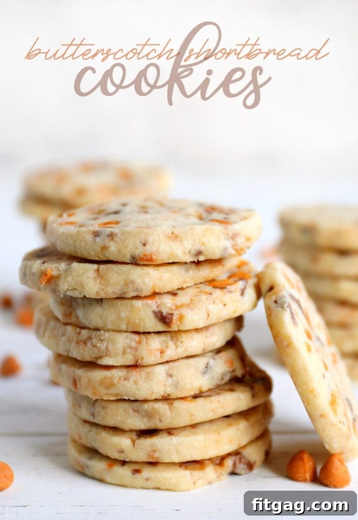 Stack of golden-brown butterscotch shortbread cookies on a white wooden background, showcasing their irresistible texture and perfect bake.