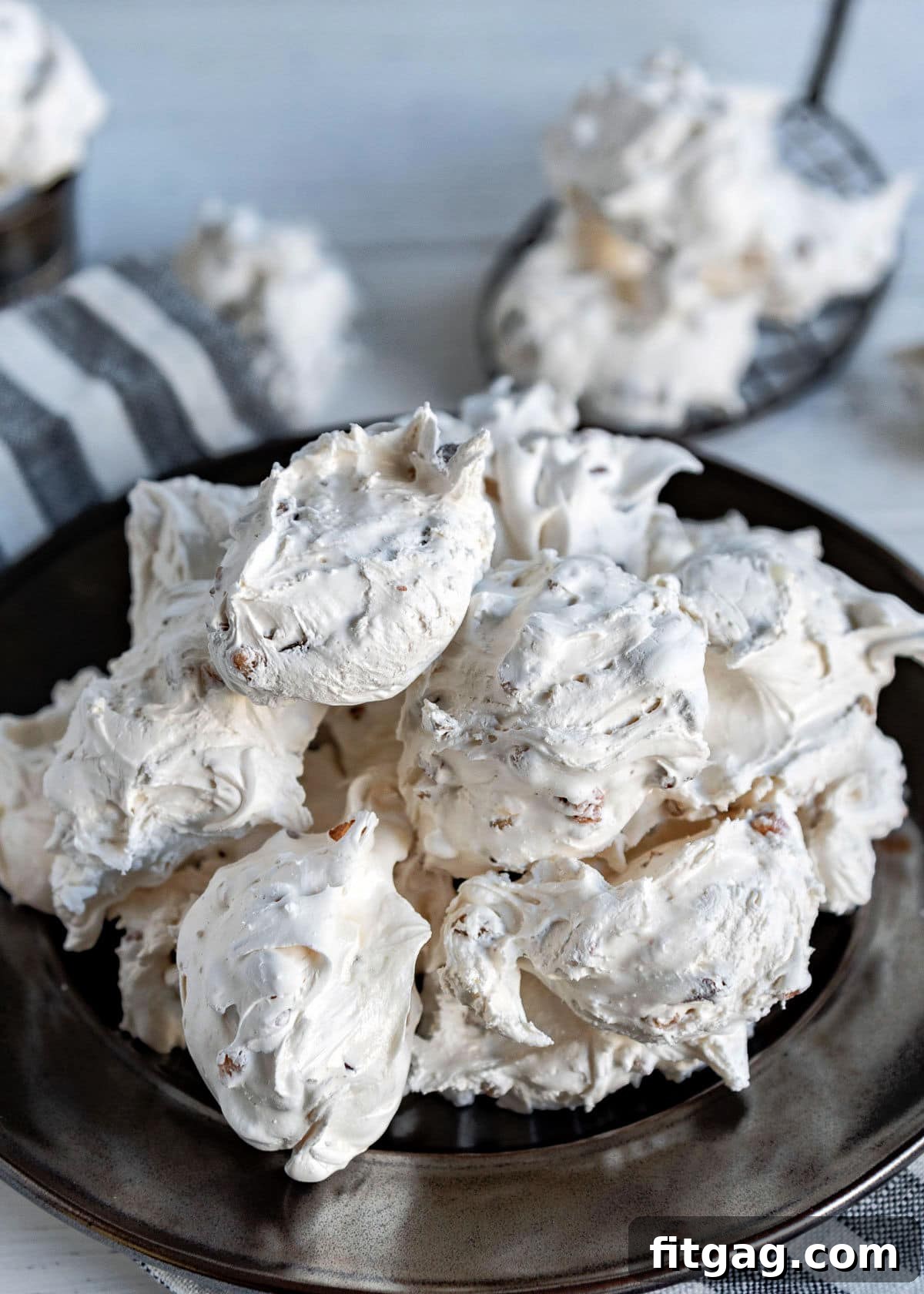 A silver plate generously filled with perfectly set divinity candy, ready to be enjoyed or shared.