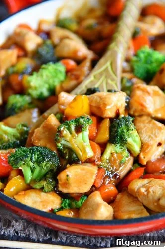 Vibrant and colorful homemade chicken stir fry loaded with fresh vegetables and a sweet and savory sauce.