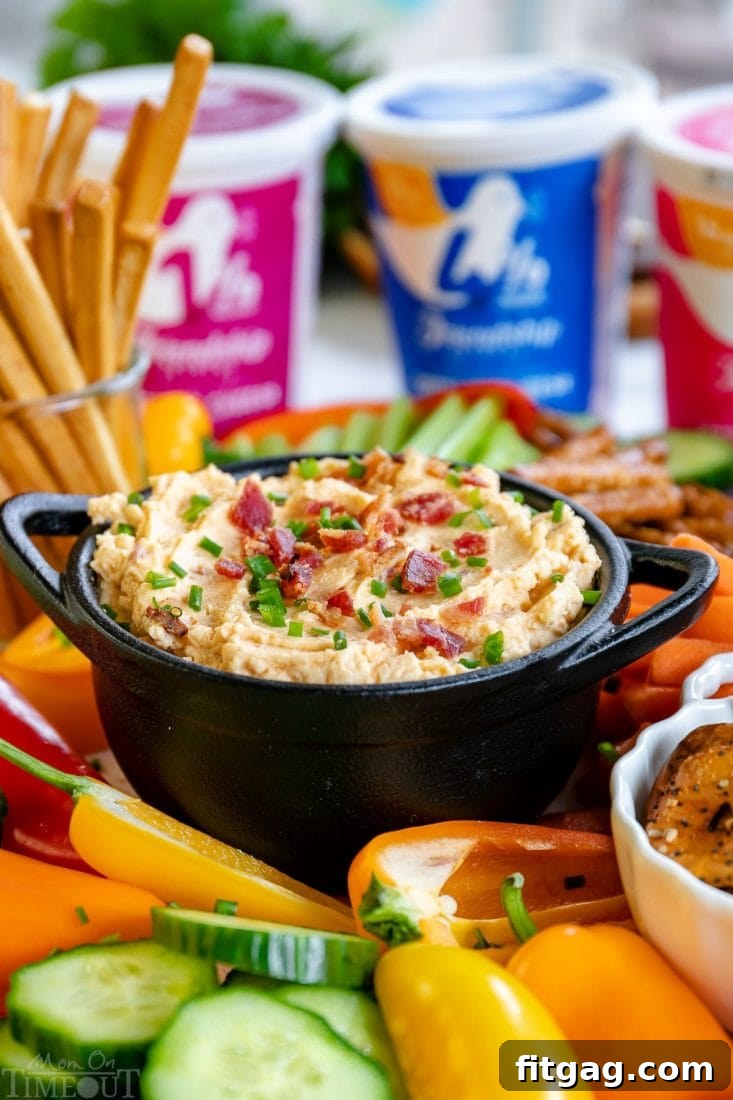 Homemade Beer Cheese Dip with Cottage Cheese for extra creaminess and tang Cold Beer Cheese Dip featuring Friendship Dairies cottage cheese, served with pretzels and fresh vegetables