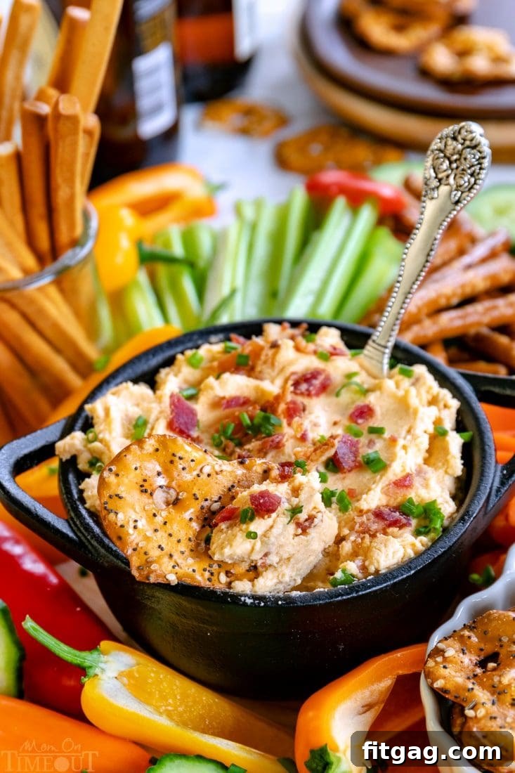 Easy Beer Cheese Dip: Bacon, Cheddar, and a Secret Creamy Ingredient for the Best Party Dip Beer Cheese Dip recipe with crispy bacon, garnished with chives