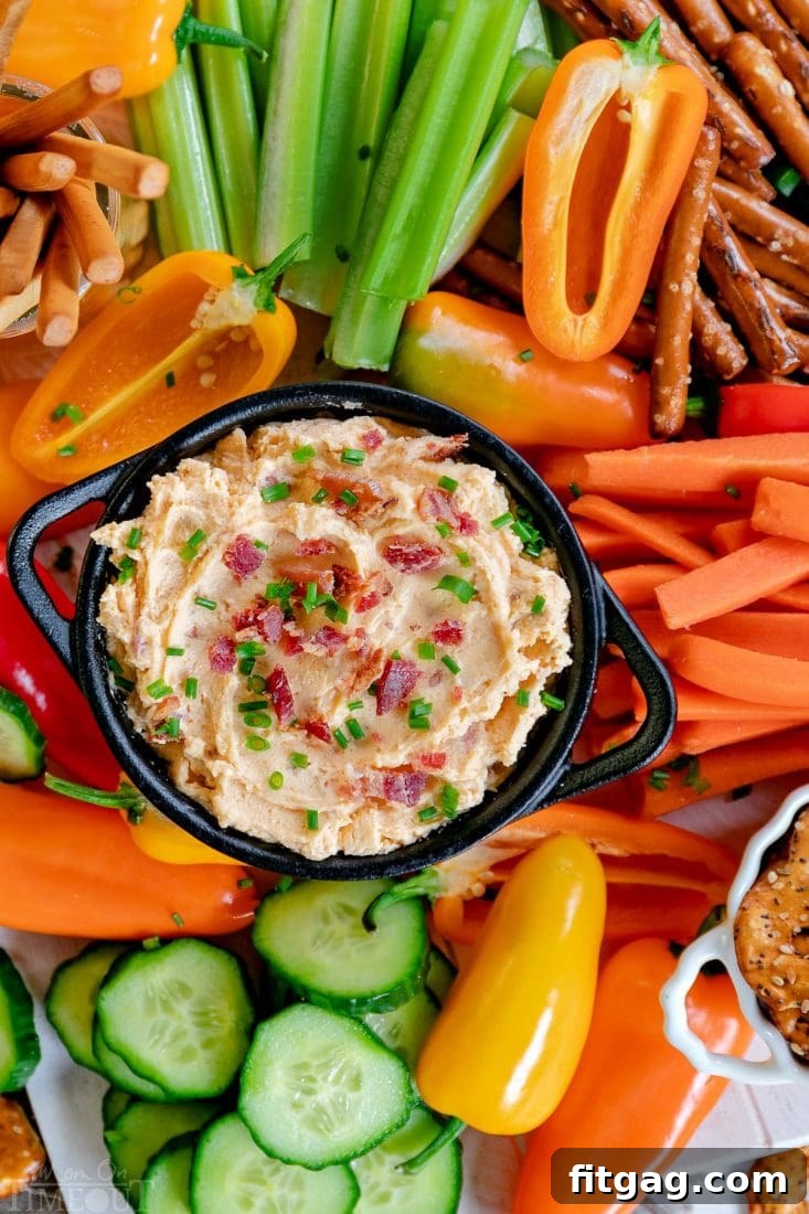 Ultimate Beer Cheese Bacon Dip 3 Close-up of Beer Cheese Dip served with various dippers, ready for a party