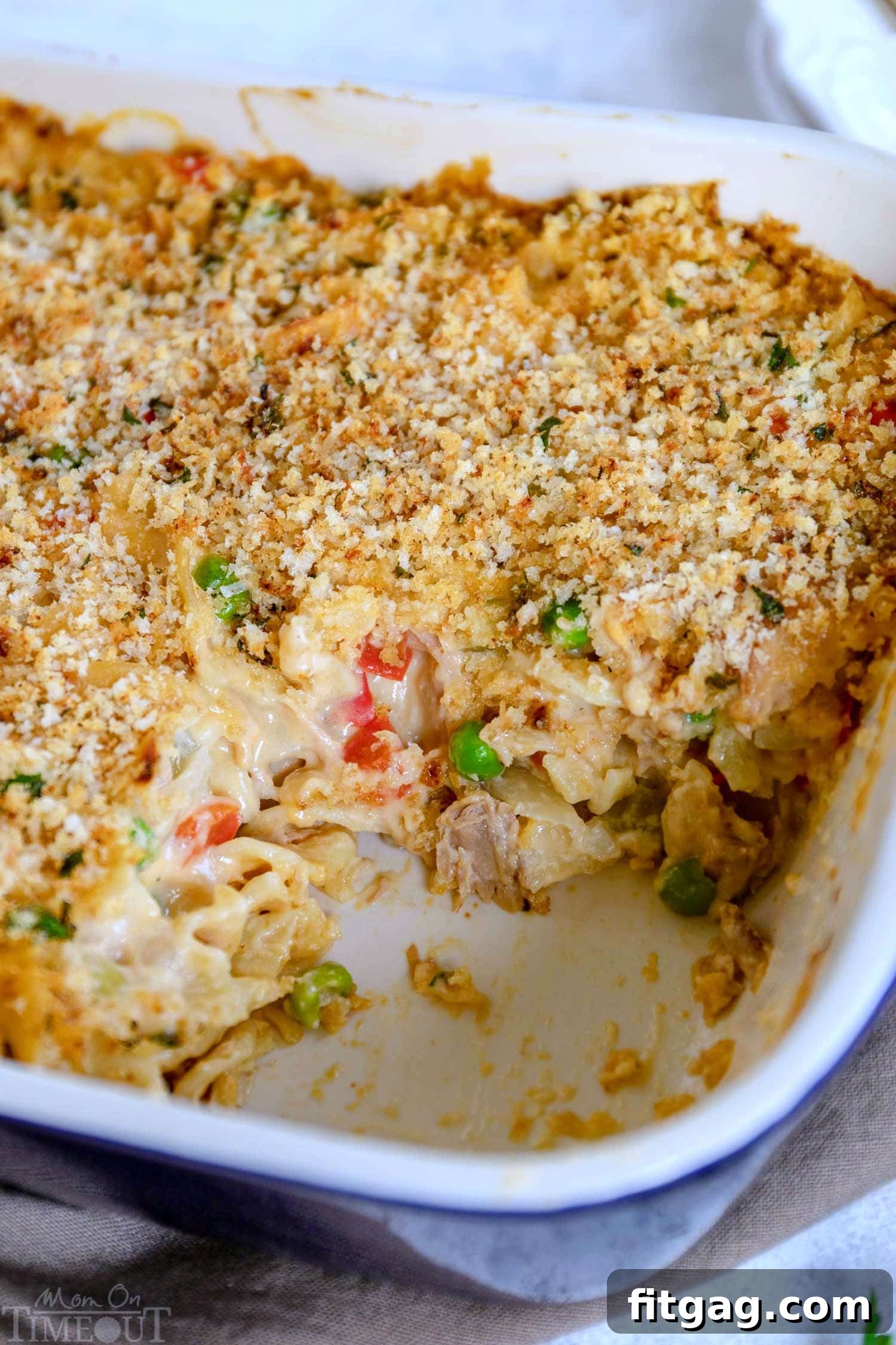 Tuna Casserole recipe with peas and a golden topping baking in a dish