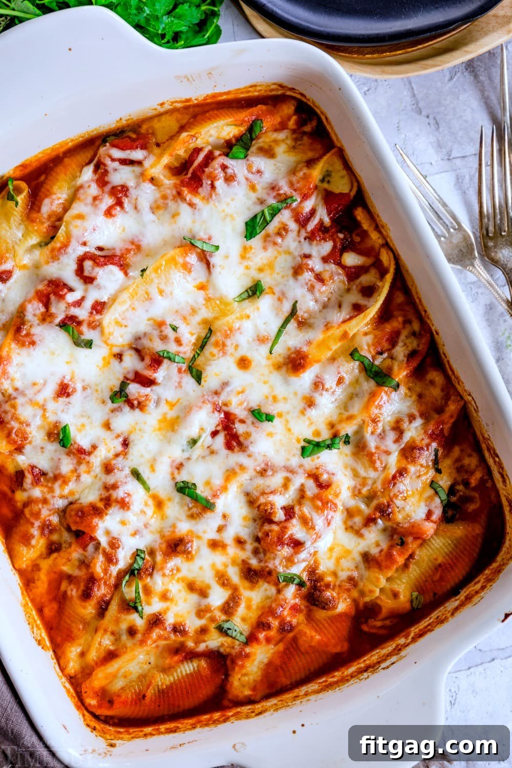 Easy Baked Stuffed Shells Easy stuffed shells recipe baked in a casserole dish.