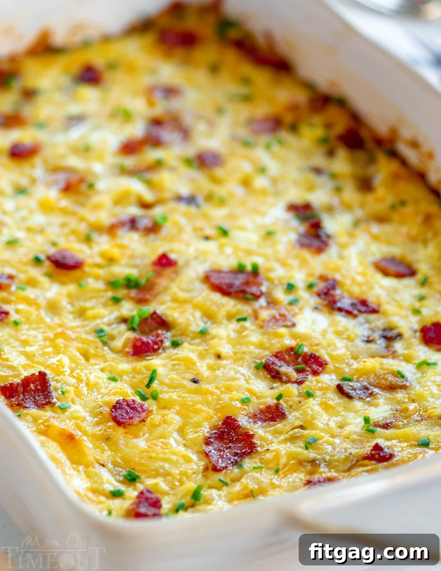 Loaded Hash Brown Breakfast Bake 3 Hash Brown Breakfast Casserole baking in a dish, showing its golden-brown top