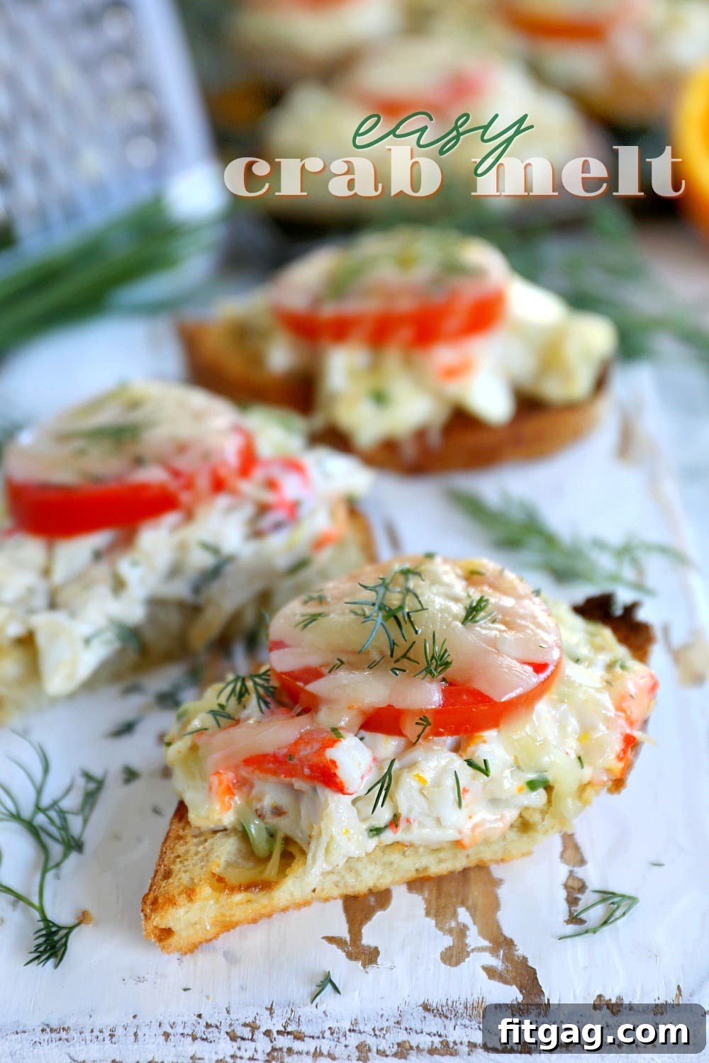 close-up of easy crab melts on sourdough bread, garnished with herbs and tomato