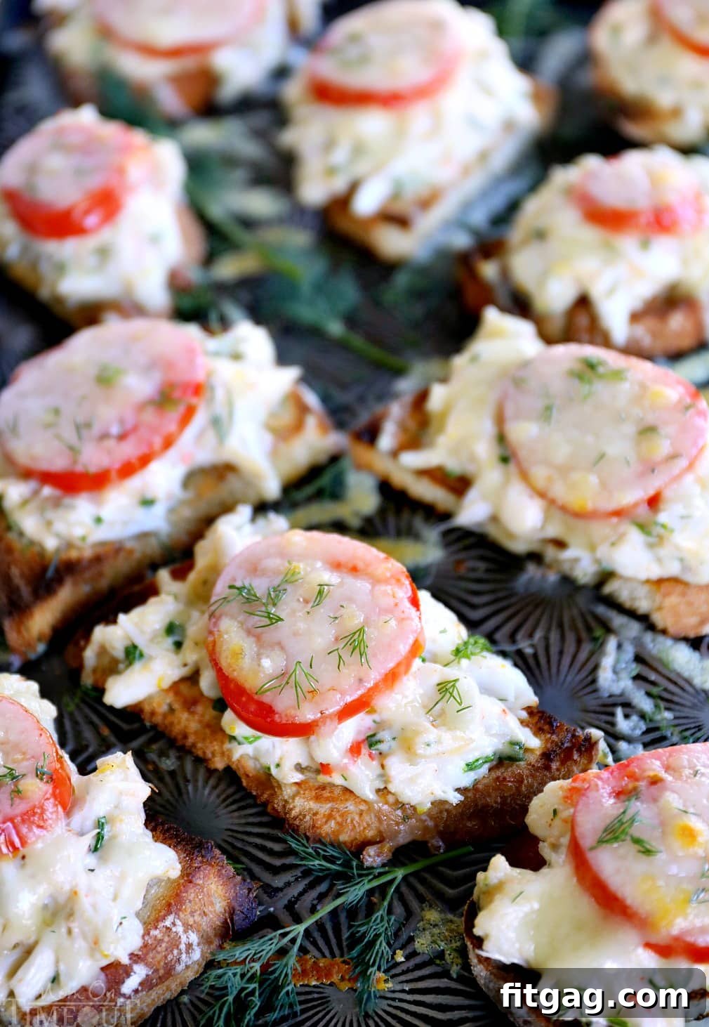 crab melt ingredients assembled on a baking sheet before broiling