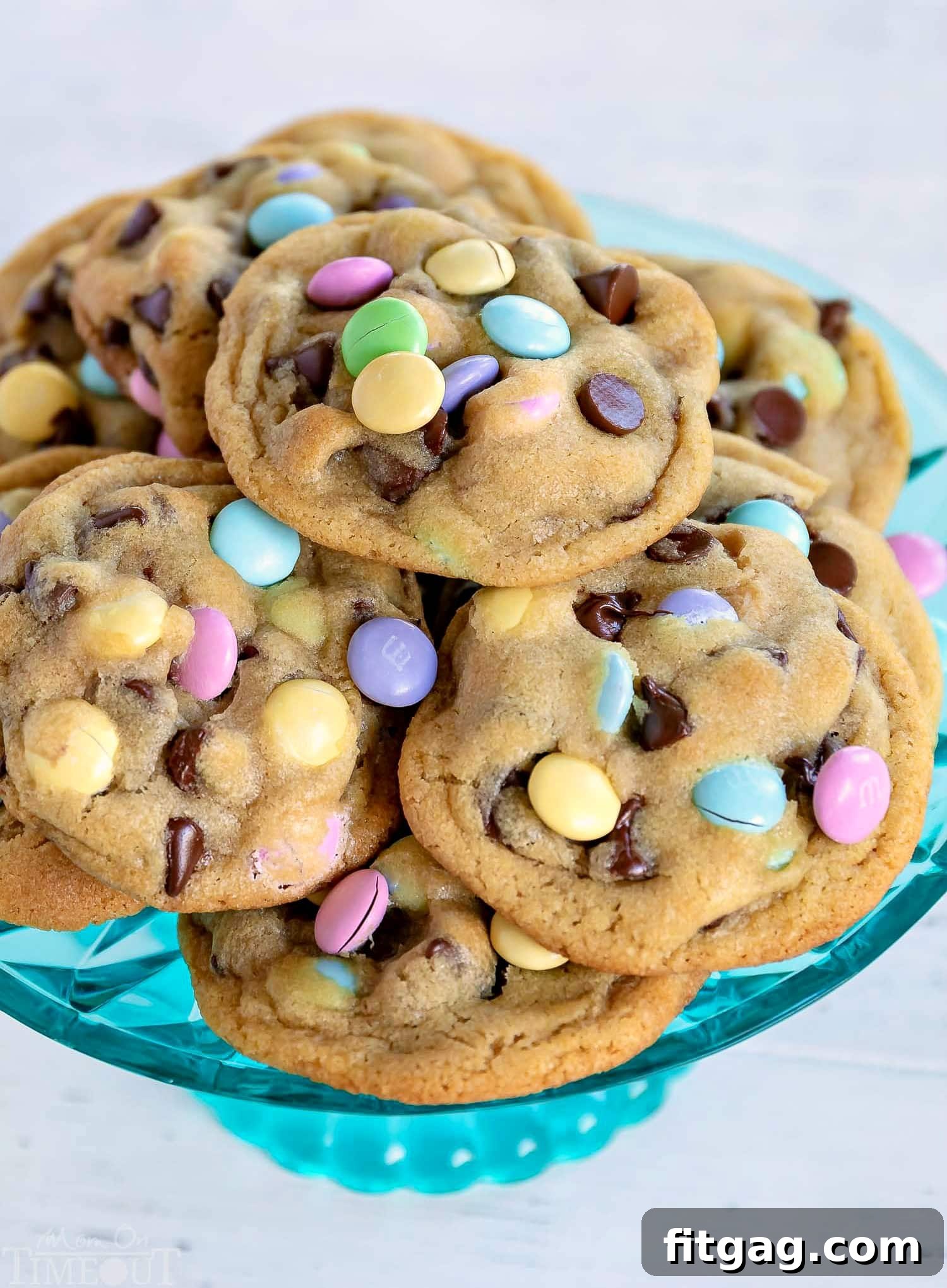 Truly the BEST Bakery Style Chocolate Chip Cookies EVER! Soft and chewy, extra thick and just loaded with sweet chocolate! Come and get 'em! // Mom On Timeout #chocolatechipcookies #Easter #cookies #baking #dessert #recipe #desserts #recipes chocolate-chip-cookies-teal-cake-stand