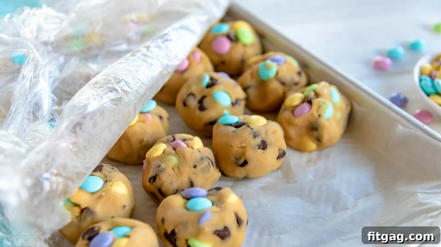 Frozen Chocolate Chip Cookie Dough Balls on Parchment Paper