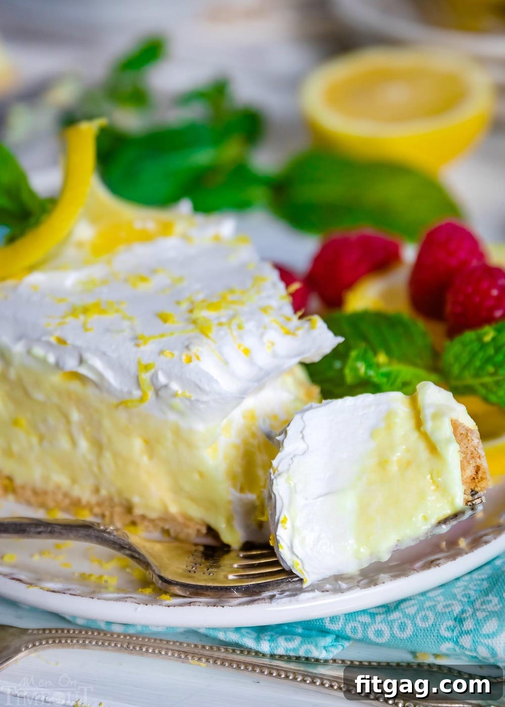 A bite of creamy No-Bake Lemon Pie on a fork, ready to be eaten