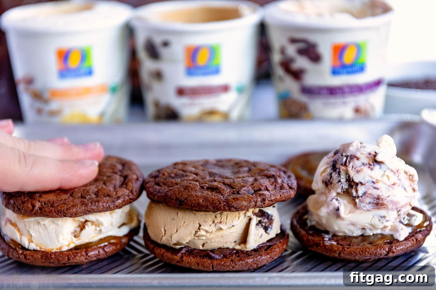 Freshly baked brownie cookies, ready to be transformed into delicious homemade ice cream sandwiches, laid out on a sheet tray.