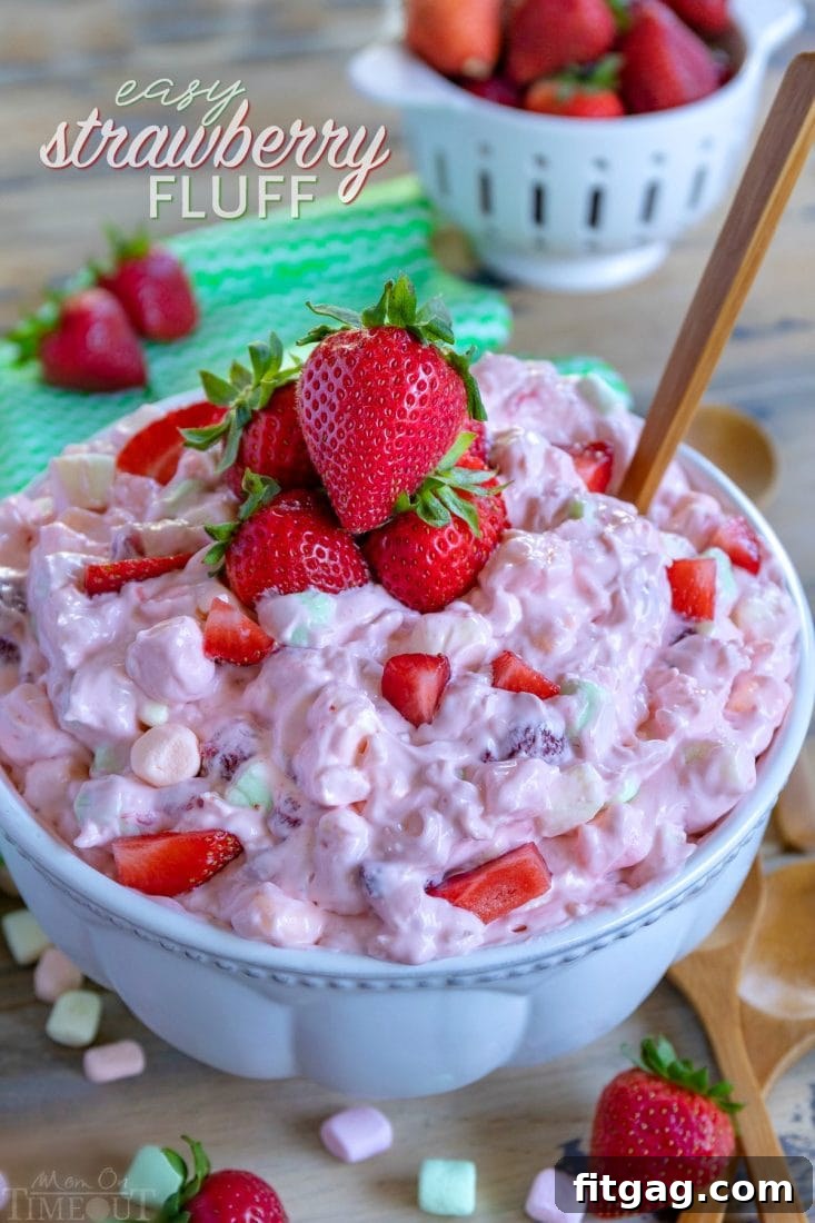 Strawberry Fluff in a large bowl, garnished with fresh strawberries
