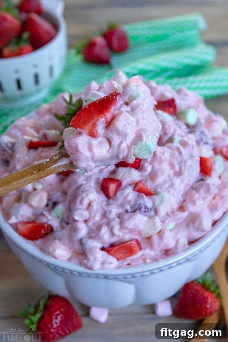 A spoonful of Strawberry Fluff, showcasing its light and creamy texture