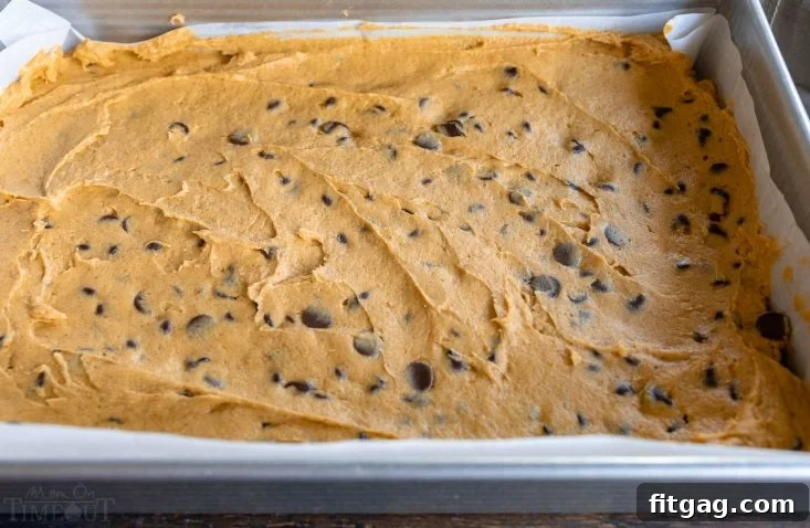 Pumpkin cake batter in a baking pan, ready for the oven