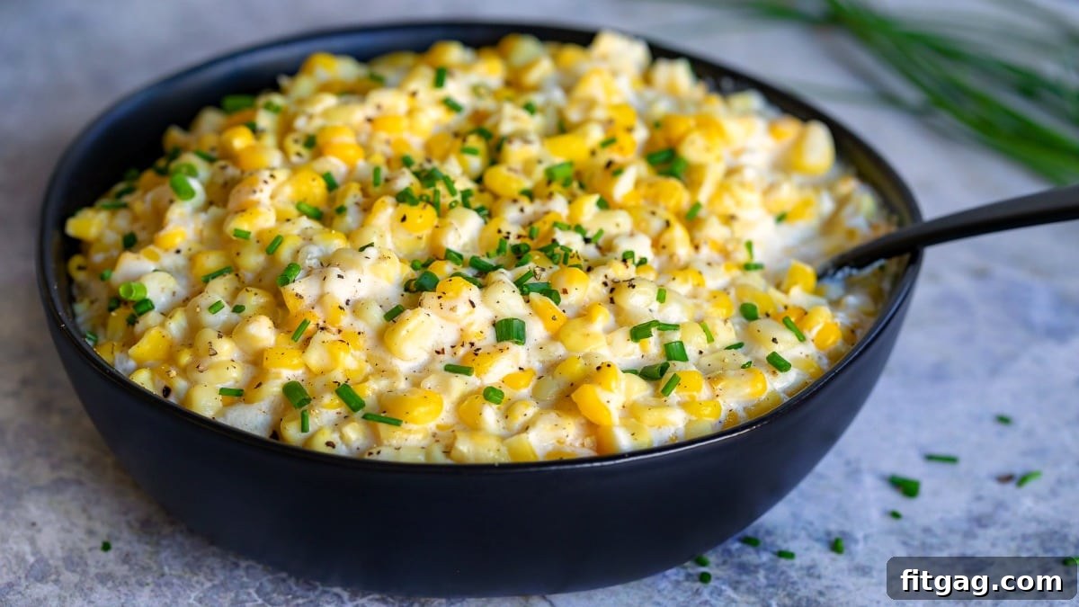 cream style corn recipe in serving bowl with chives