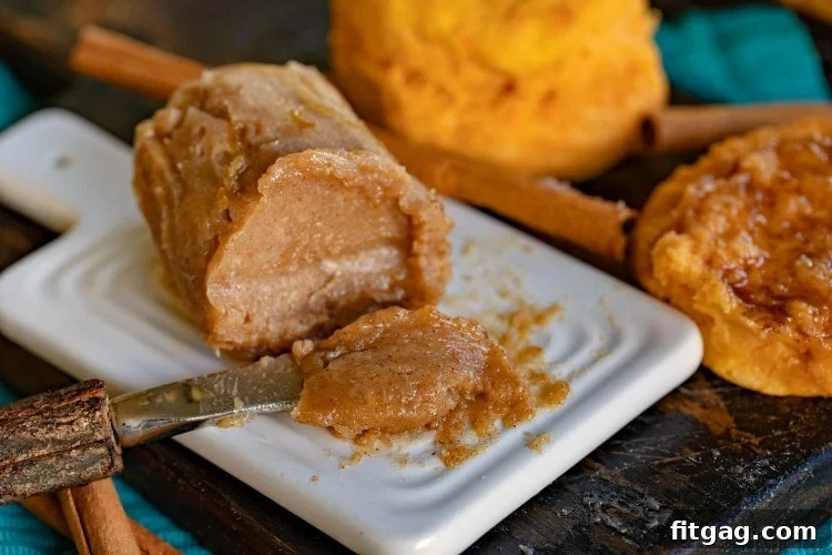 Close-up of freshly made brown sugar cinnamon butter in a butter dish with a spreading knife