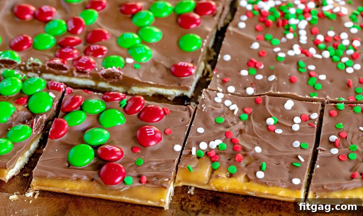 Christmas Toffee Craze 3 A large sheet of freshly made saltine toffee, perfectly cut into uniform squares, rests on a rustic wooden cutting board, ready for serving. Each piece showcases the distinct layers of cracker, caramel, and chocolate.