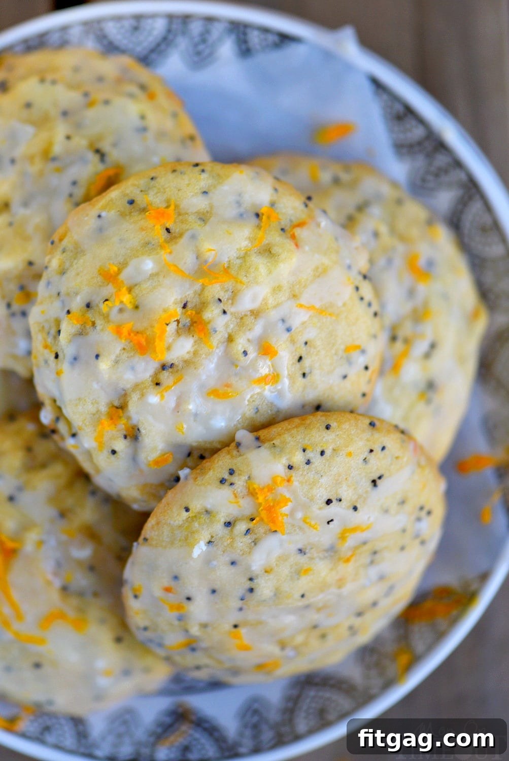 These easy Glazed Orange Poppy Seed Cookies are bursting with orange flavor! So soft and tender, these cookies will quickly become a new favorite! Bonus: no chill time needed! // Mom On Timeout #cookies #orange #poppyseed #easy #baking #dessert poppy seed cookies with orange glaze top down