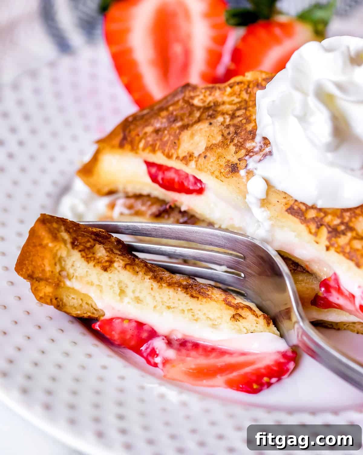 Strawberry Stuffed French Toast with a delightful bite Close-up of a bite of Strawberry Stuffed French Toast