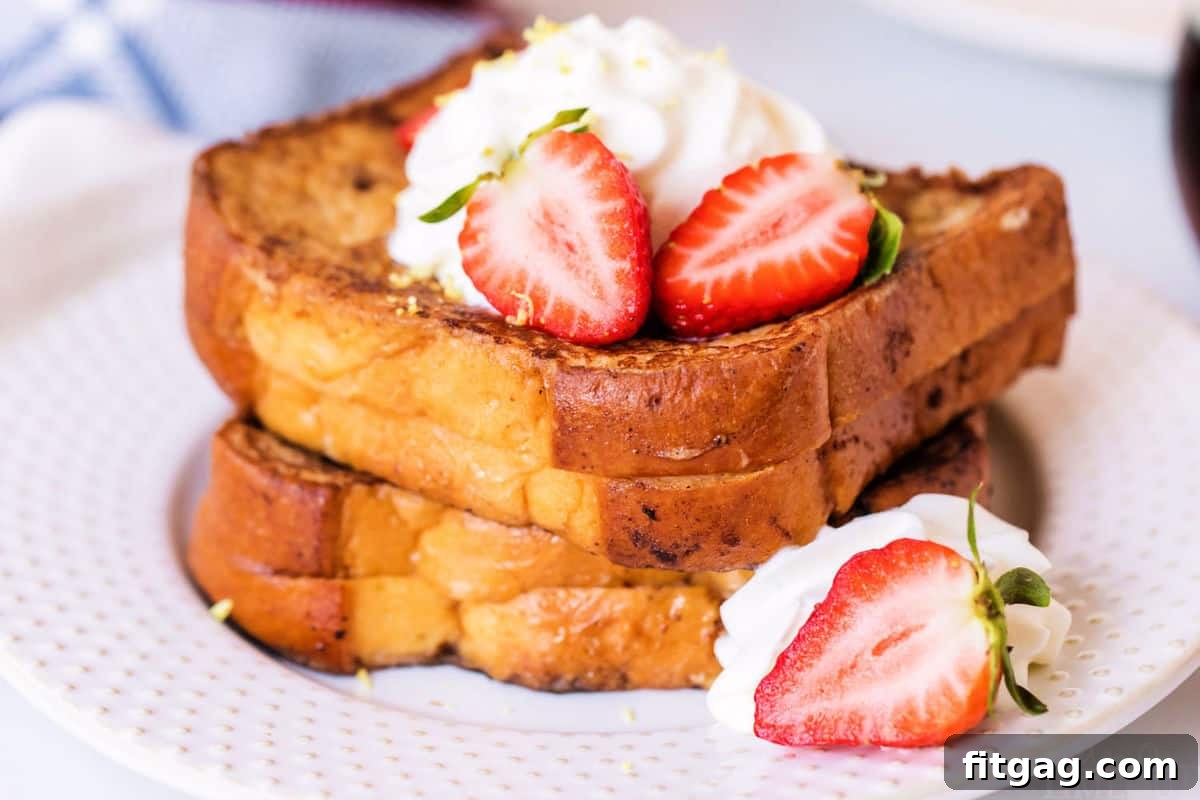 Perfect Strawberry Stuffed French Toast Generously stuffed strawberry French toast on a plate