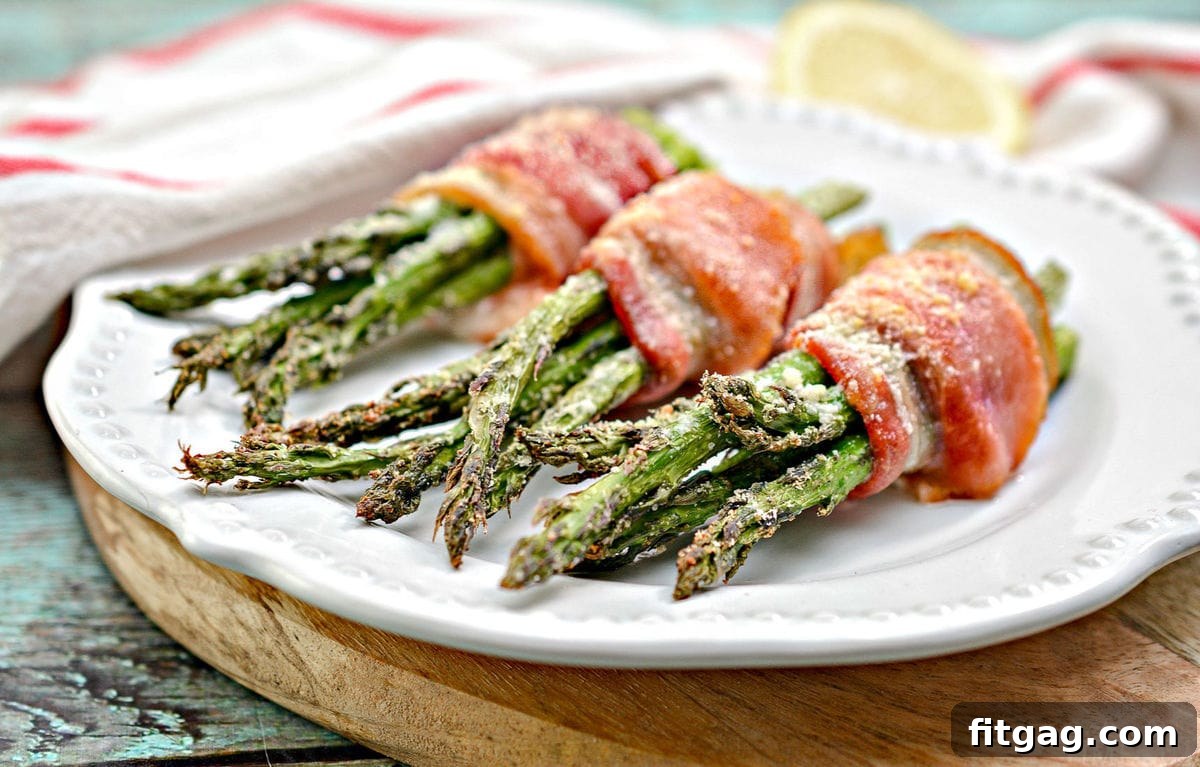 Plated bacon wrapped asparagus ready to serve on a cutting board
