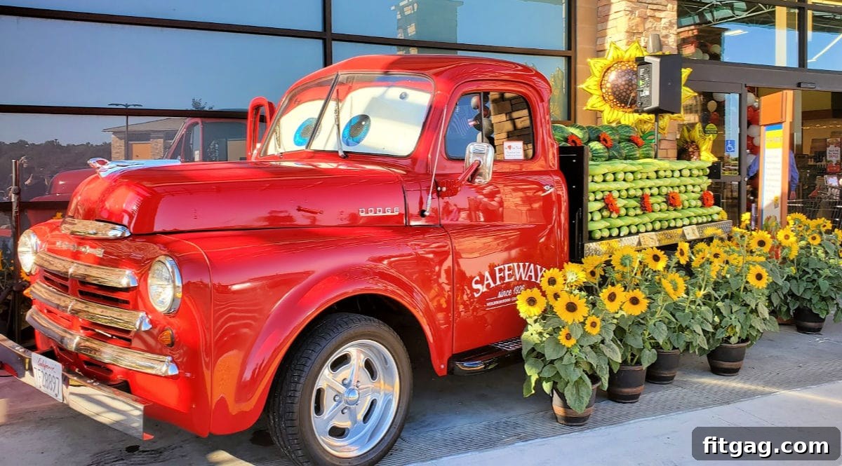 red safeway truck with produce on flatbed of truck in front of store