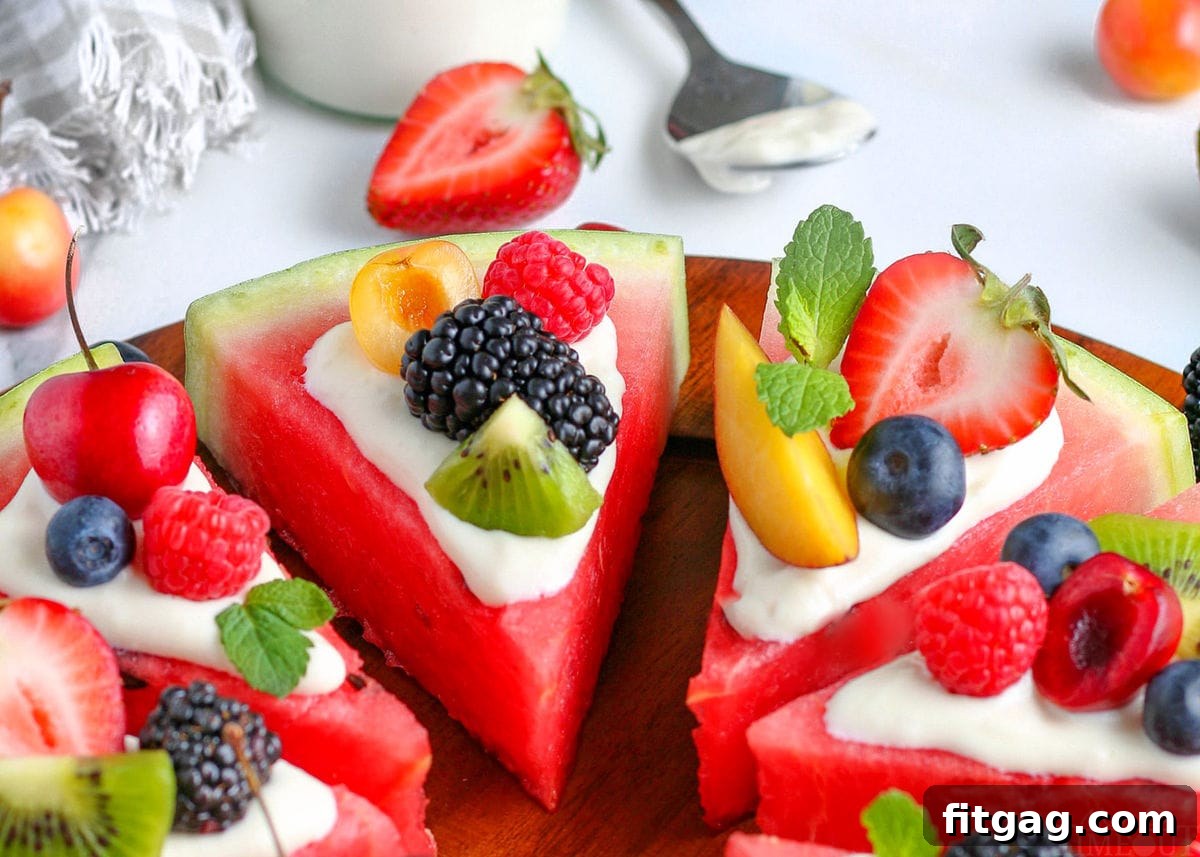 Summer's Sweetest Slice 7 A close-up view of freshly prepared watermelon pizza wedges, each topped with a delicate cream cheese glaze and a colorful assortment of fresh fruit, artfully arranged on a wooden cutting board.