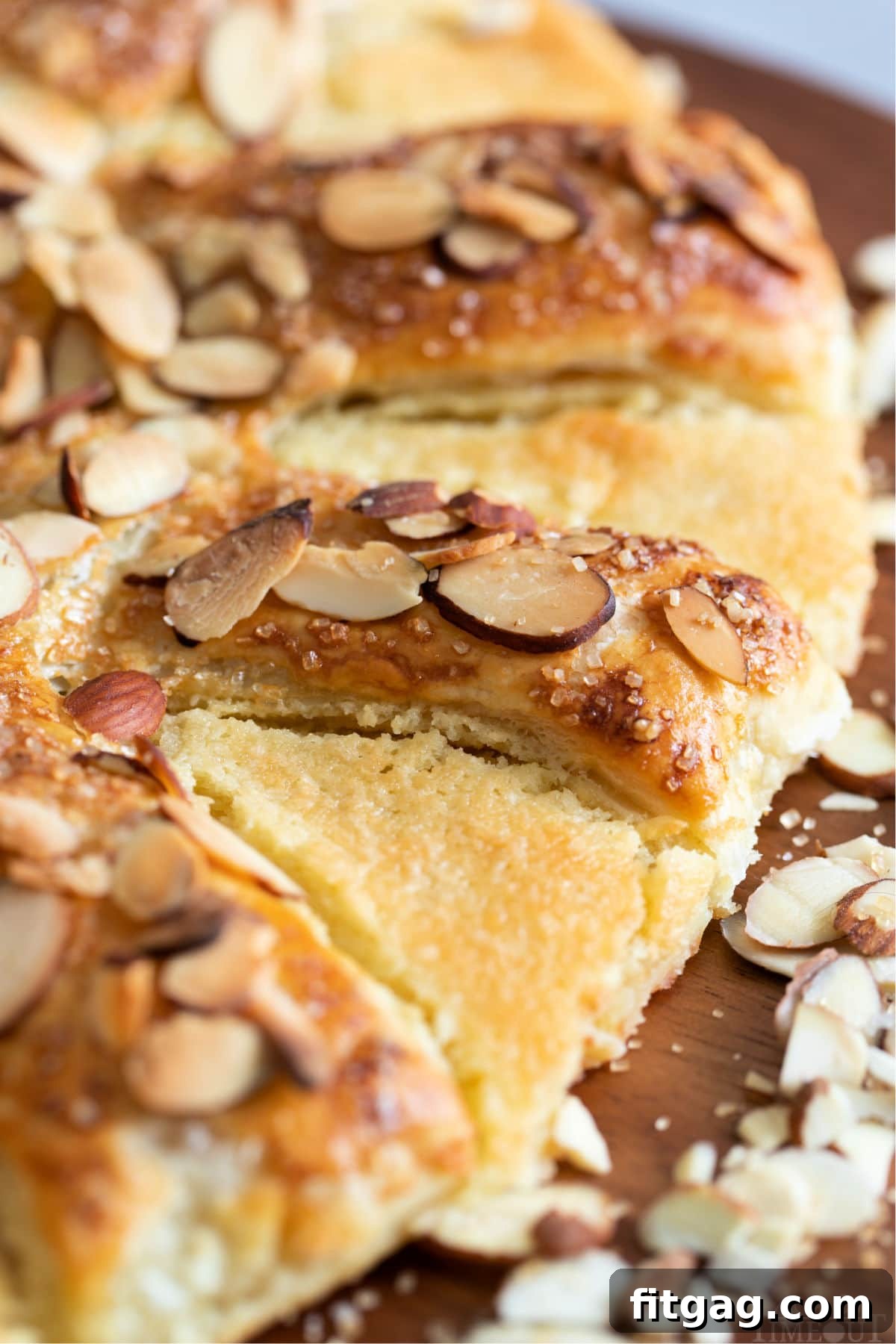 Effortless Almond Bear Claws 9 close up of bear claw pastry with sliced almonds on top, highlighting the flaky texture and golden crust