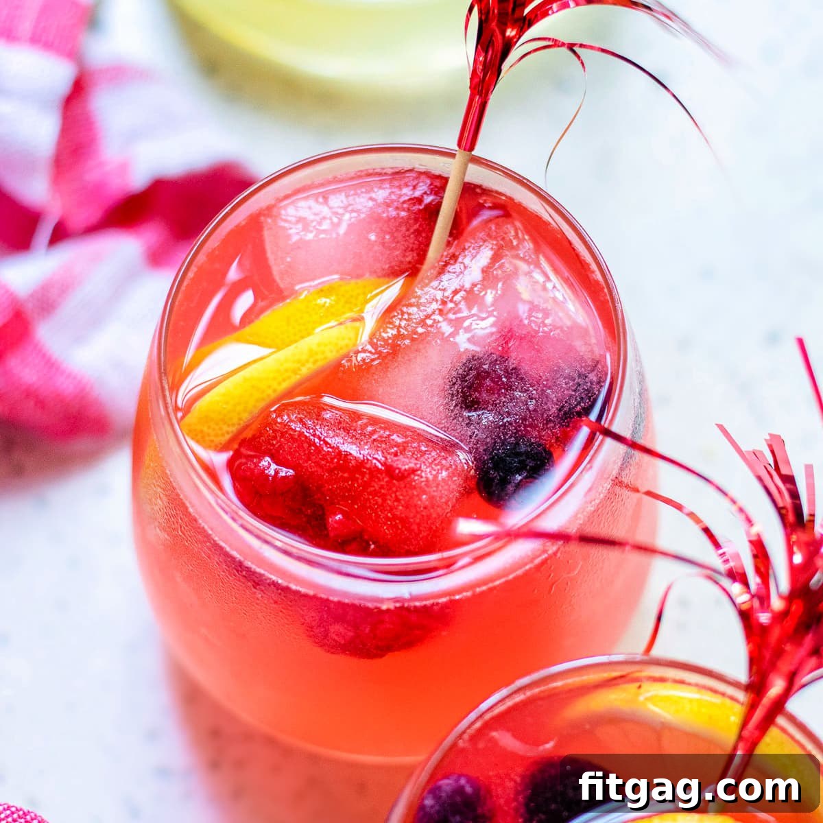 Overhead view of two glasses of berry lemonade, showcasing the rich color and inviting presentation.