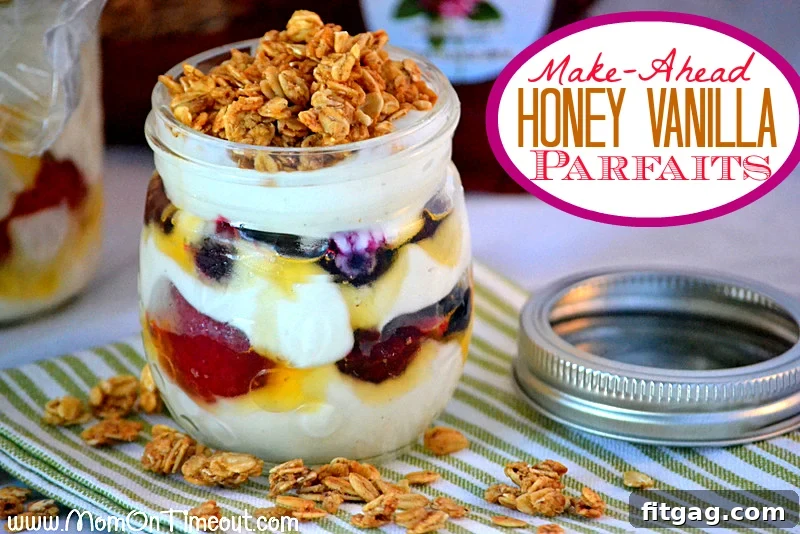 Two jars of layered honey vanilla parfaits with berries and granola, perfect for grab-and-go mornings