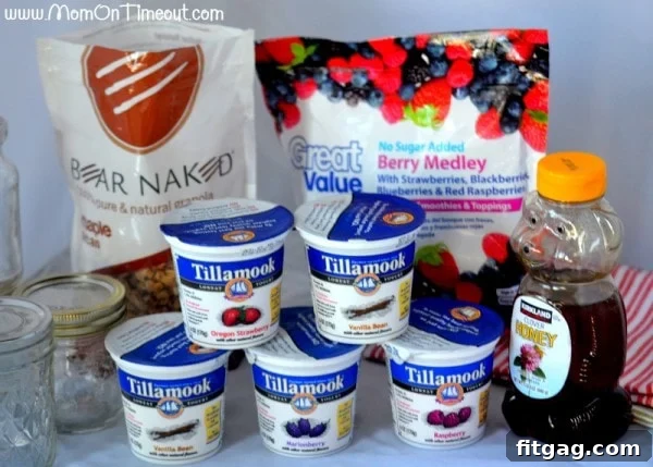 Ingredients for simple and delicious Honey Vanilla Parfaits including yogurt, honey, berries, and granola
