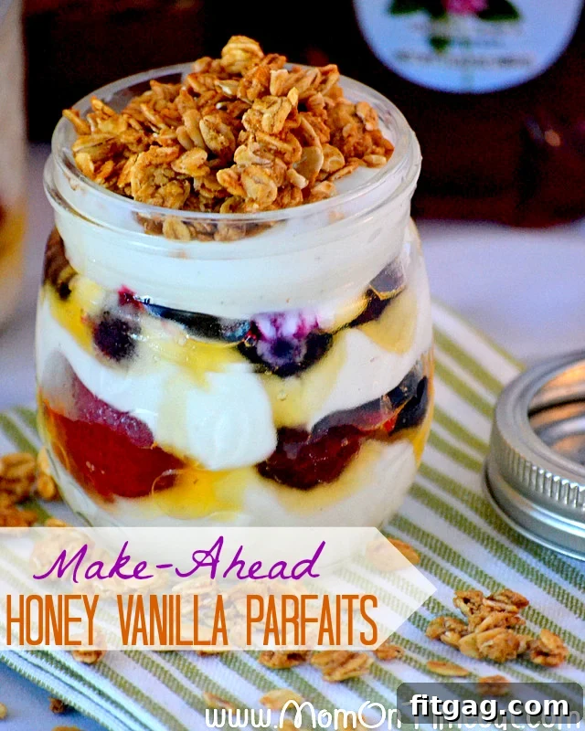 A beautifully layered honey vanilla parfait in a jar, garnished with berries, ready to eat