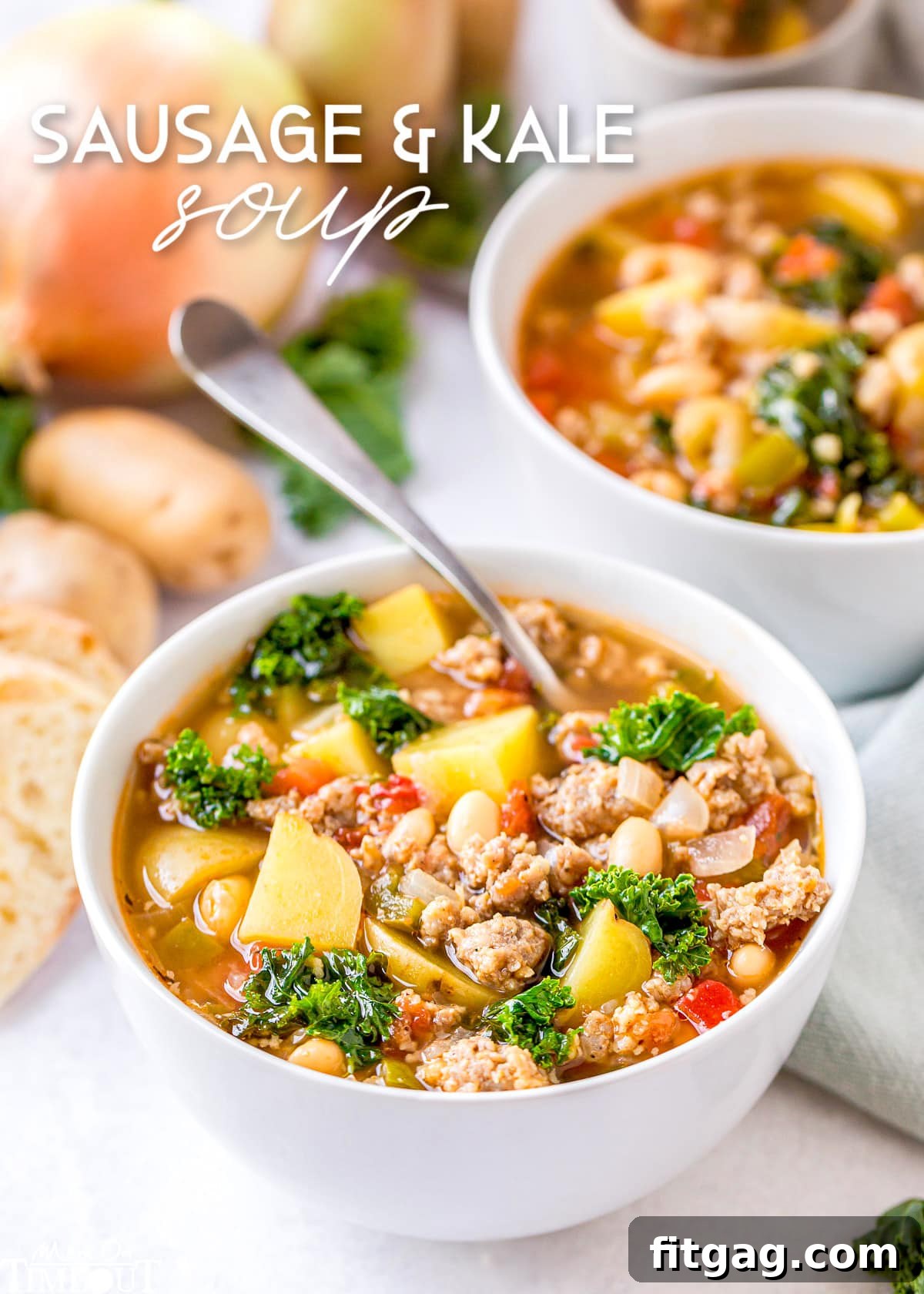 A steaming bowl of hearty sausage kale soup with a spoon, perfect for a cozy meal.